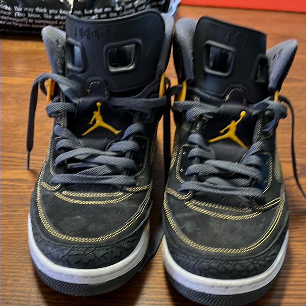 Jordan Black and Yellow Sneakers Classic Mid-Top Design